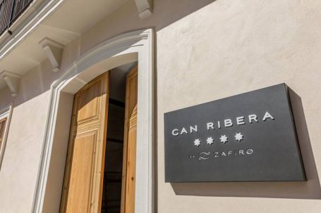 The main hotel door with a sign reading 'Can Ribera'